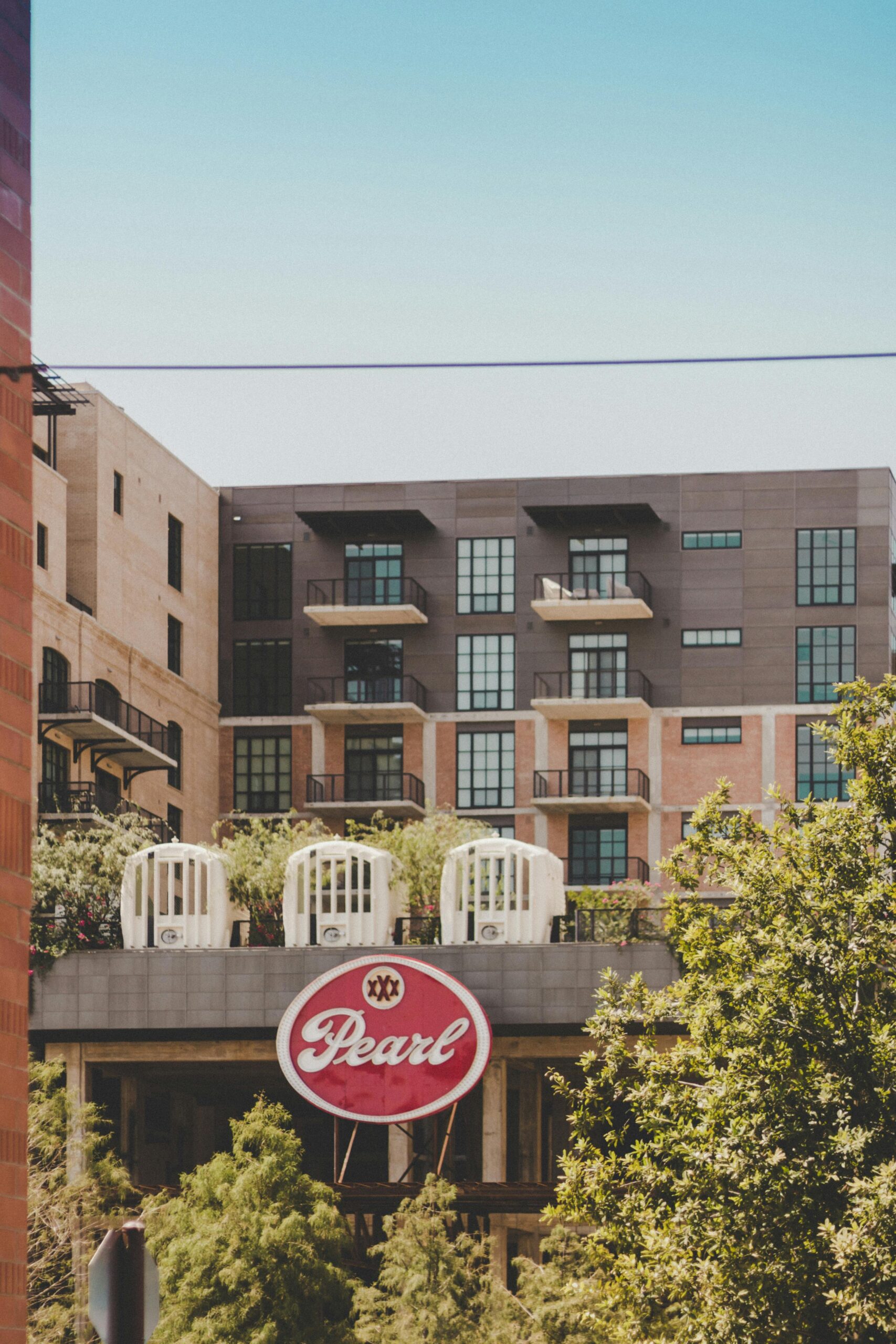 Contemporary building exterior with balconies at Pearl District in San Antonio, Texas.